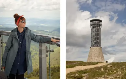 Kobieta na tarasie widokowym z widokiem na góry, obok wieża widokowa. Szlak na Śnieżnik prowadzi do tego miejsca.